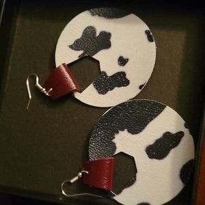 Homemade leather fish hook back earrings. Cow print